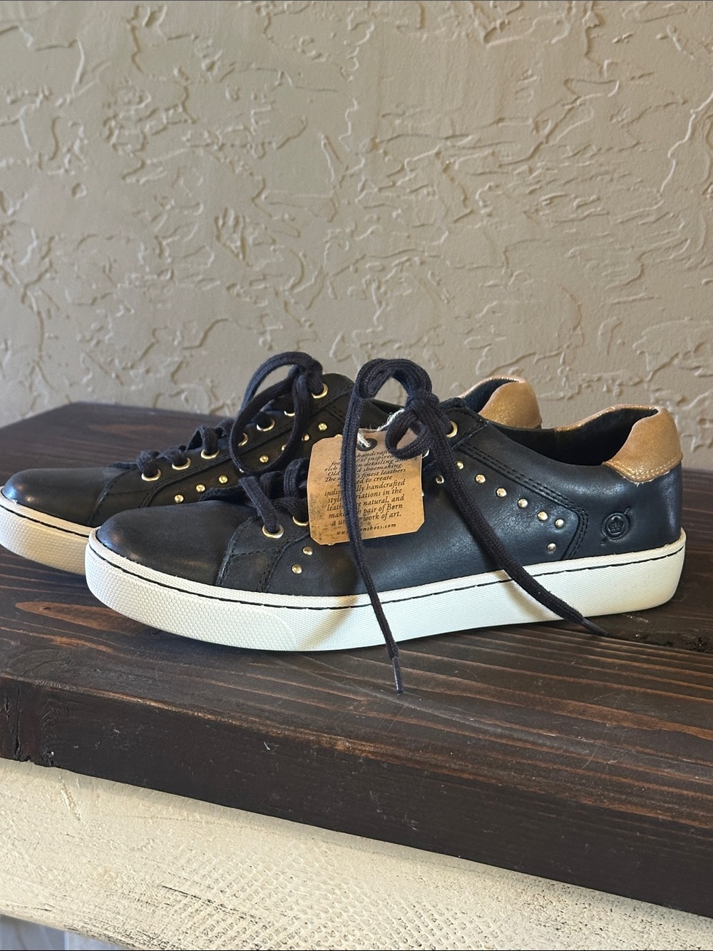 Born black leather and gold stud, lace up tennis shoe size 7
